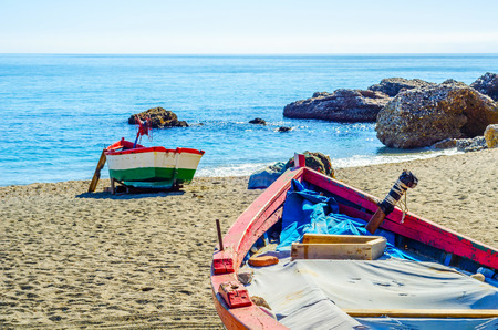 Old boat on the shore on the sand, vacation, beach for tourists, sunny dayの写真素材