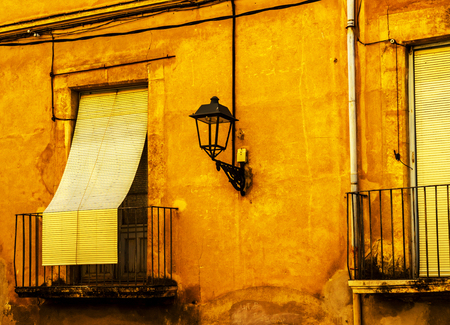 Stylish balcony with a metal railing, solid architectural element, a place of rest and relaxation, vintage decor, balconyの写真素材