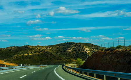 Fast road in the mountains in Spain, beautiful landscape of mountains, dry earth and rock from the...