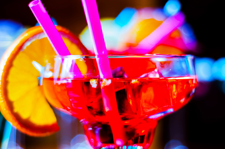 Tasty and colorful drinks based on various alcohols, syrups and liqueurs, unique effect of the bartender's work, party nightの写真素材