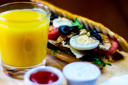 grilled sandwich with various cold meats, cheese, mushrooms, tomato and egg, tasty and healthy...