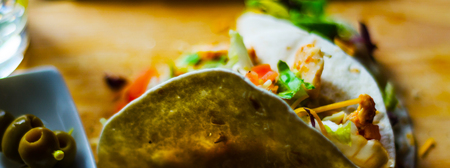 Tasty fresh wrap sandwich with meat, vegetables and cheese, delicious snack, healthy foodの写真素材