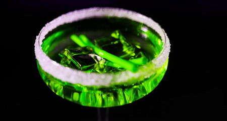 Tasty and colorful drinks based on various alcohols, syrups and liqueurs, unique effect of the bartender's work, party nightの写真素材