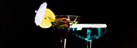 Tasty and colorful drinks based on various alcohols, syrups and liqueurs, unique effect of the bartender's work, party nightの写真素材