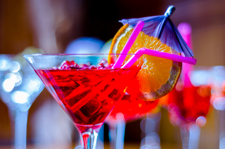 Tasty and colorful drinks based on various alcohols, syrups and liqueurs, unique effect of the bartender's work, party nightの写真素材