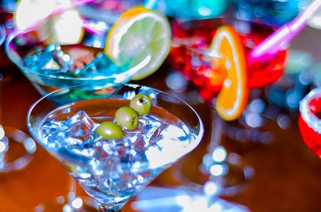 Tasty and colorful drinks based on various alcohols, syrups and liqueurs, unique effect of the bartender's work, party nightの写真素材