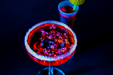 Tasty and colorful drinks based on various alcohols, syrups and liqueurs, unique effect of the bartender's work, party nightの写真素材