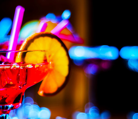 Tasty and colorful drinks based on various alcohols, syrups and liqueurs, unique effect of the bartender's work, party nightの写真素材
