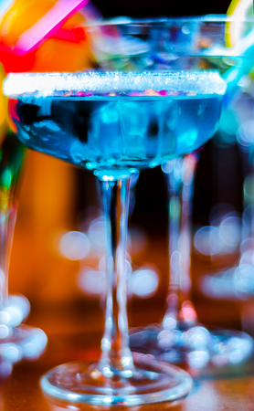 Tasty and colorful drinks based on various alcohols, syrups and liqueurs, unique effect of the bartender's work, party nightの写真素材