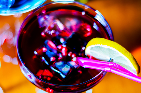 Tasty and colorful drinks based on various alcohols, syrups and liqueurs, unique effect of the bartender's work, party nightの写真素材