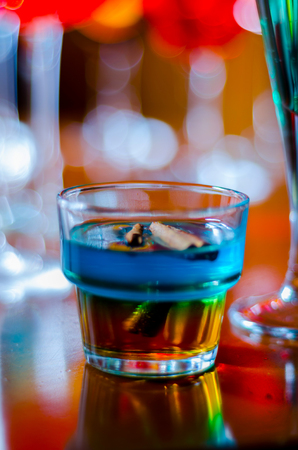 Tasty and colorful drinks based on various alcohols, syrups and liqueurs, unique effect of the bartender's work, party nightの写真素材