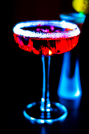 Tasty and colorful drinks based on various alcohols, syrups and liqueurs, unique effect of the bartender's work, party nightの写真素材