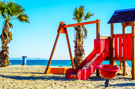 Colorful children's Playground on the beach on a hot day, Playground for children near the sea, relax and funの写真素材