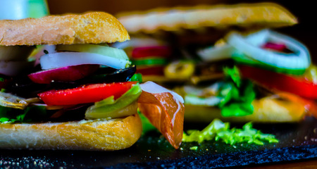 Mini grilled sandwich with various cold meats, cheese, mushrooms, tomato and egg, tasty and healthy snack, hot foodの写真素材