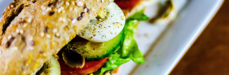 Whole grain sandwich with ham, tomato, mushrooms and egg, fresh organic vegetables, healthy foodの写真素材