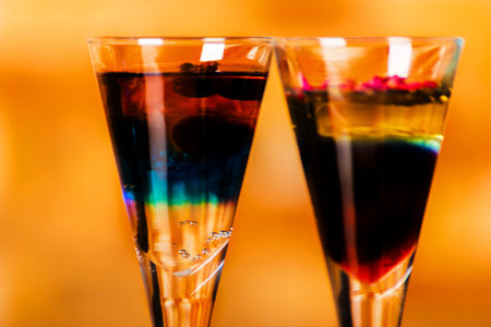 Tasty and colorful drinks based on various alcohols, syrups and liqueurs, unique effect of the bartender's work, party nightの写真素材