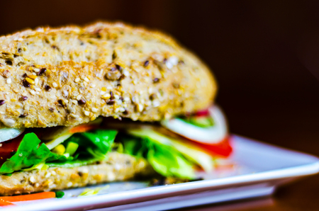 Whole grain sandwich with ham, tomato, mushrooms and egg, fresh organic vegetables, healthy foodの写真素材