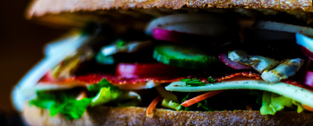 Grilled sandwich with various cold meats, cheese, mushrooms, tomato and egg, tasty and healthy snack, hot foodの写真素材