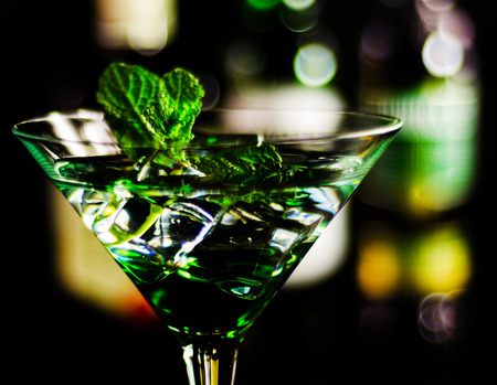 Green mint liqueur, refreshing drink with fresh mint, energizing cocktail, party nightの写真素材