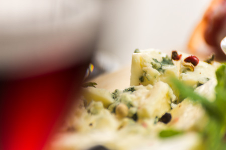 Set of different cheeses on a wooden board, cheese board, delicious snack, healthy and exclusive food, cheese setの写真素材