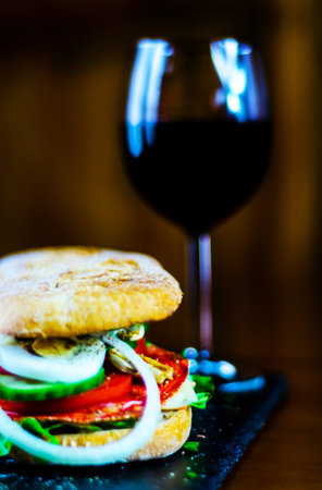 Grilled sandwich with various cold meats, cheese, mushrooms, tomato and egg, tasty and healthy snack, hot foodの写真素材