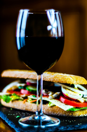 Red Wine and sandwich, dry wine perfect for eating, a gourmet setの写真素材