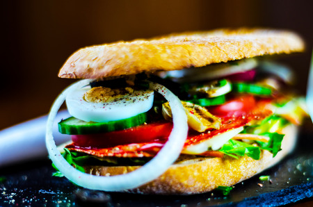 Grilled sandwich with various cold meats, cheese, mushrooms, tomato and egg, tasty and healthy snack, hot foodの写真素材