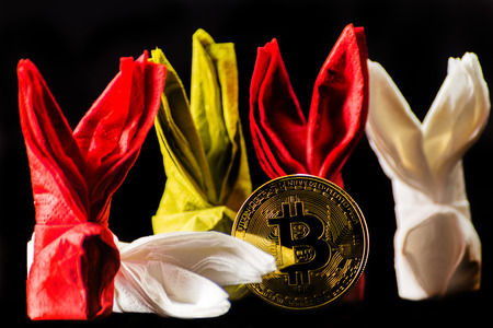 Crypto currency Gold Bitcoin, BTC, macro shot of Bitcoin coins with bunny napkin,  bitcoin and easter conceptの写真素材