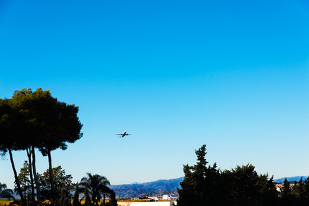 Passenger plane flying in the blue sky, cruise aircraft, transport industry, aviationの写真素材