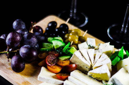 set of different cheeses on a wooden board, cheese board, delicious snack, healthy and exclusive...