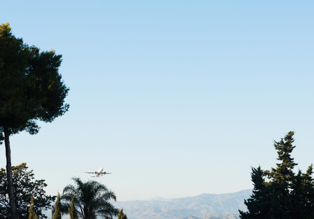 Passenger plane flying in the blue sky, cruise aircraft, transport industry, aviation