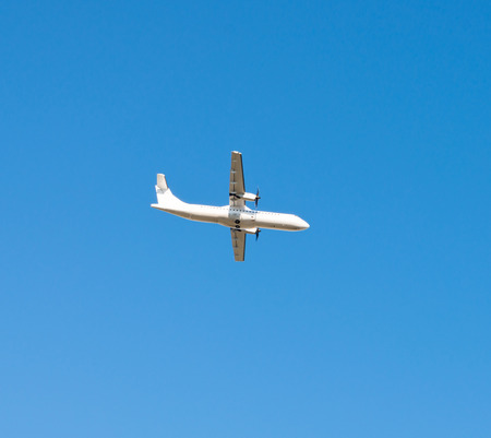 Passenger plane flying in the blue sky, cruise aircraft, transport industry, aviationの写真素材