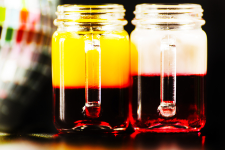 colorful drink shot on disco mirror ball background, refreshing mini drink, party nightの写真素材