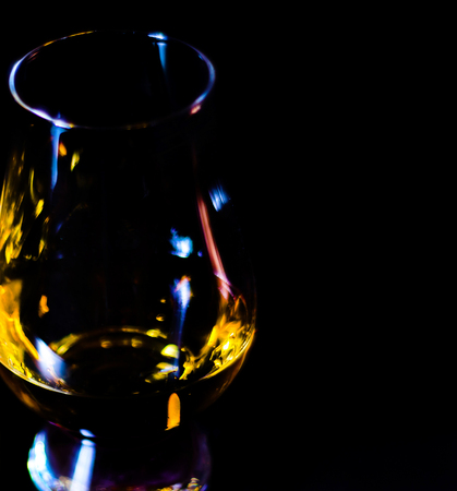 Single malt whiskey in a glass of tasting with napkin bunny, festive Easter decoration, holidayの写真素材