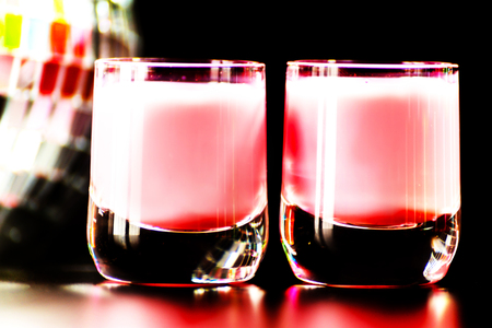 colorful drink shot on disco mirror ball background, refreshing mini drink, party nightの写真素材