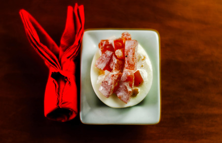 stuffed eggs with hand-made filling and bunny napkin, healthy and tasty snack, easterの写真素材