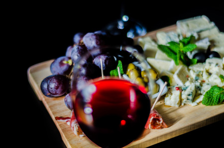 set of different cheeses on a wooden board, cheese board, delicious snack, healthy and exclusive food, cheese setの写真素材