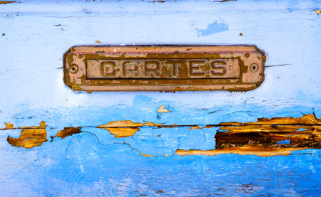 Old letterbox in the door, traditional way of delivering letters to the house, old mailbox, correspondenceの写真素材