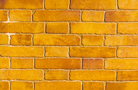 old brick placed in the wall, interesting and original background, solid wall