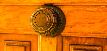 close up on a round door handle with decorative elements, door decoration, vintage