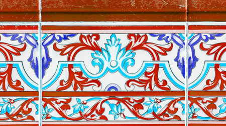 Traditional ornamental Spanish decorative tiles, original ceramic tiles on the walls of buildings, decorationの写真素材