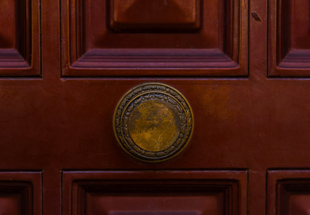 close up on a round door handle with decorative elements, door decoration, vintage