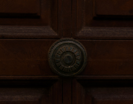 close up on a round door handle with decorative elements, door decoration, vintageの写真素材