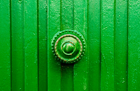 close up on a round door handle with decorative elements, door decoration, vintageの写真素材