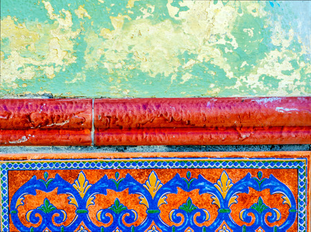 Traditional ornamental Spanish decorative tiles, original ceramic tiles on the walls of buildings, decorationの写真素材