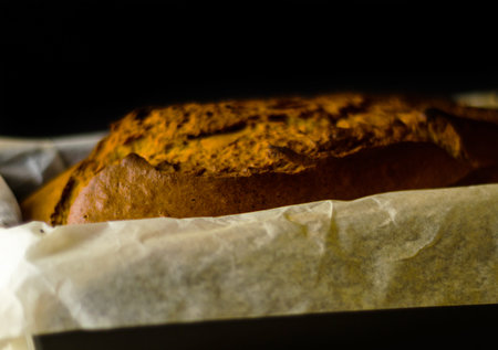 Freshly baked banana cake with nuts, banana bread in baking form, homemade bakingの写真素材