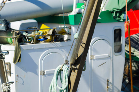 Close-up on an item from a fishing boat, a cutter anchored in a port, sea industry