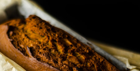 Freshly baked banana cake with nuts, banana bread in baking form, homemade bakingの写真素材