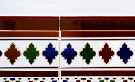 Traditional ornamental Spanish decorative tiles, original ceramic tiles on the walls of buildings,...