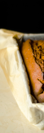 Freshly baked banana cake with nuts, banana bread in baking form, homemade bakingの写真素材